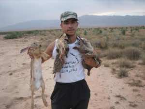Imad Tigani holding what he hunted
