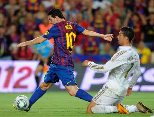 Barcelonas-Lionel-Messi-L-escapes-from-Real-Madrids-Cristiano-Ronaldo-during-a-Spanish-Supercup-match-at-the-Camp-Nou-stadium-in-Barcelona-on-August-17-2011-AFPFile-Lluis-Gene-.jpg