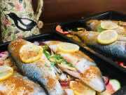 Cooking Moroccan roasted sea bass with peppers