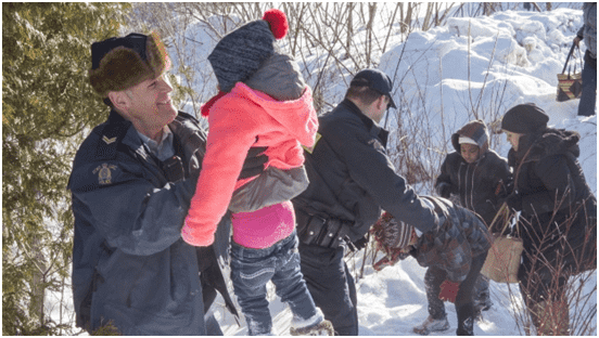 Royal Canadian Mounted Police Help Refugee Family Cross Border into Canada