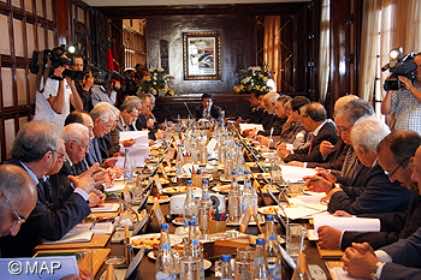 Chairman of political mechanism hands other members full text of constitutional