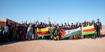 Damning photos show PKK separatists and Polisario militants hoisting flags together in Tindouf.