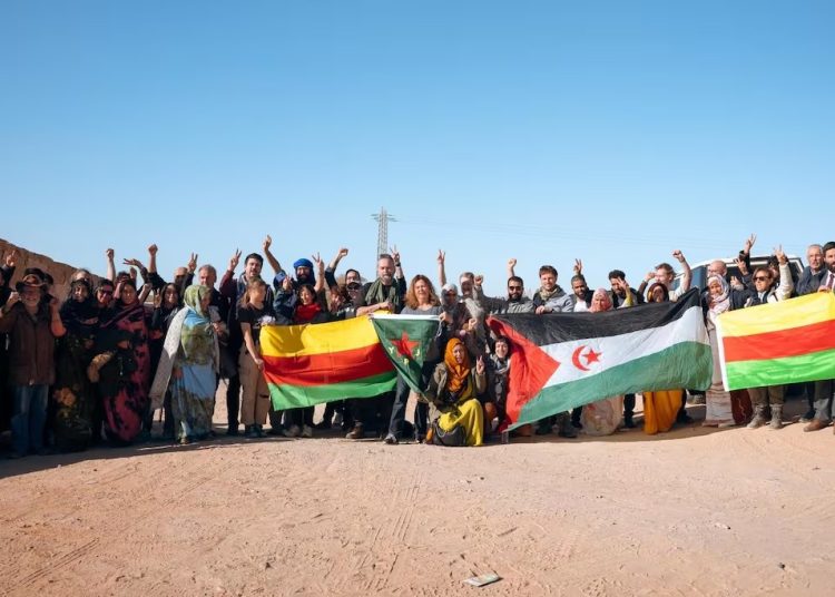Damning photos show PKK separatists and Polisario militants hoisting flags together in Tindouf.