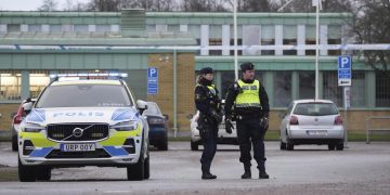 Police near the scene of the shooting. Photo credit: AP Photo/Sergei Grits
