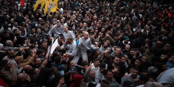 Palestinian prisoners arriving in Ramallah. Afif Amireh for The New York Times