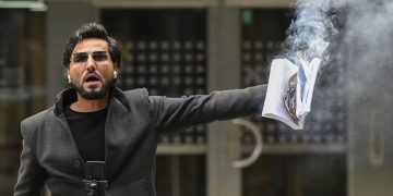 Salwan Momika burning Quran in Benny Fredriksson's quare in Stockholm in August 2023. Photo credit: Ander Wiklund/TT