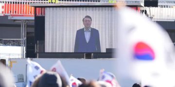 A screen shows footage of impeached Yoon Suk-yeol as supporters stage a rally to oppose his impeachment near the presidential residence in Seoul    credits: Lee Jin-man/AP Photo.
