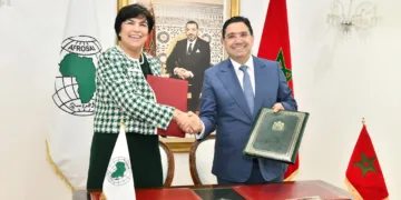Moroccan Minister of Foreign Affairs Nasser Bourita and Zineb El Adaoui, First President of the Court of Accounts signing the agreement