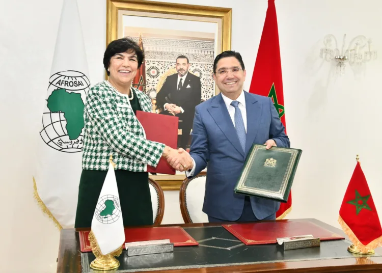 Moroccan Minister of Foreign Affairs Nasser Bourita and Zineb El Adaoui, First President of the Court of Accounts signing the agreement
