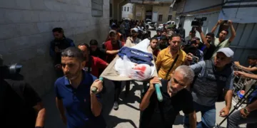 Mourners carry the body of Palestinian journalist Ismail Baddah, who was killed in an Israeli air strike on al-Ahli Arab Hospital in Gaza City, on June 5, 2025 [Dawoud Abu Alkas/Reuters]