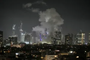 Smoke rises after a missile attack in Tel Aviv [Leo Correa/AP Photo]