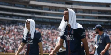 PSG players covering their heads with cold towels under the scorching heat of the Club World Cup in the US.