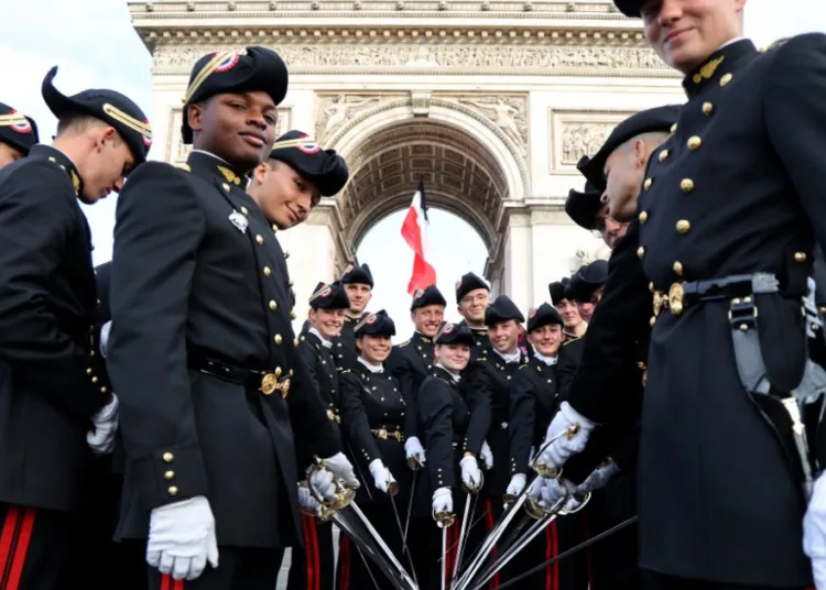 French military academy students from École Polytechnique pose ahead of the Bastille Day parade on Paris’s Champs-Élysées, July 14, 2025. ©AFP