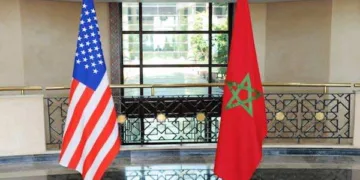 A group of US senators shaking hands with Moroccan officials during a diplomatic meeting, symbolizing strong bilateral relations and strategic cooperation between the United States and Morocco.