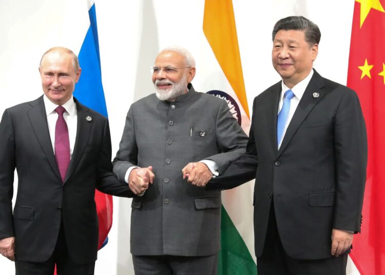 President of Russia Vladimir Putin, the President of China Xi Jinping, and India's Prime Minister Narendra Modi. MIKHAIL KLIMENTYEV/AFP