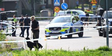 Police at the scene of the attack. AP