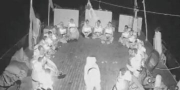A screengrab from a live video footage shows crew members sitting in a circle aboard the Gaza-bound Alma vessel. [Global Sumud Flotilla/Handout via Reuters] (Reuters)