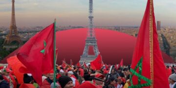 Moroccans waving Morocco flags in Paris, France