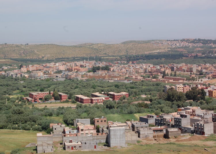 A panoramic view of Demnate’s green valleys and High Atlas foothills.