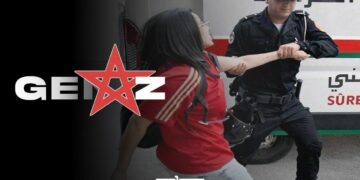 A police man dragging a female protester during a Gen Z demonstration