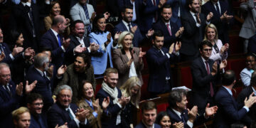 Marine Le Pen (C) and other RN MPs applaud during a session at the National Assembly, 30 October, 2025. © Anne-Christine Poujoulat / AFP