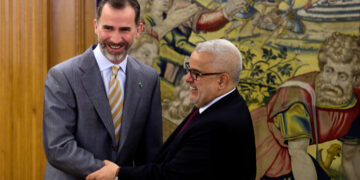 Spain’s King Felipe VI shakes hands with Abdelillah Benkirane at La Zarzuela palace near Madrid on June 5, 2015.