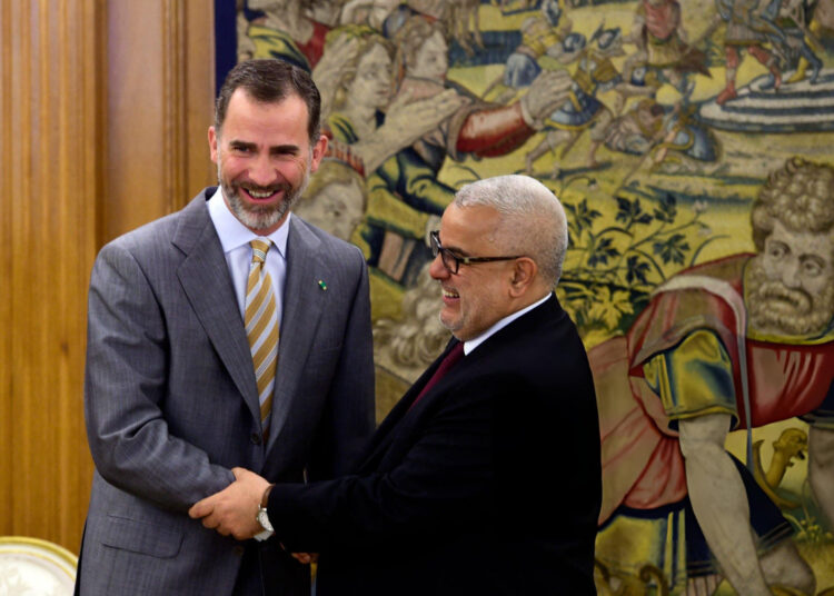 Spain’s King Felipe VI shakes hands with Abdelillah Benkirane at La Zarzuela palace near Madrid on June 5, 2015.