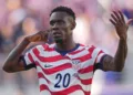 A major controversy has erupted at the 2026 FIFA World Cup after FIFA overturned Folarin Balogun's suspension, allowing the United States striker to play in the Round of 16 against Belgium despite receiving a red card in the previous match.