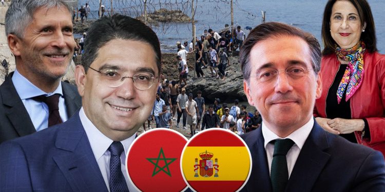 From left: Spain’s Interior Minister Fernando Grande-Marlaska, Morocco’s Foreign Minister Nasser Bourita, Spanish Foreign Minister José Manuel Albares, and Defense Minister Margarita Robles, against the backdrop of the July Ceuta crossings. While Rabat and Madrid maintain close diplomatic coordination, tensions inside Spain’s own government have increasingly shaped the political fallout from the crisis.