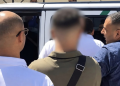 Authorities detain a man at a Tangier polling station during Morocco’s 2026 legislative elections.