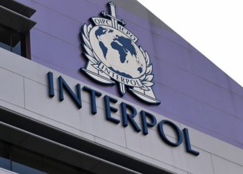 The INTERPOL emblem displayed on the exterior of the international policing organization’s headquarters.