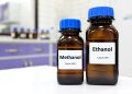 Laboratory bottles labeled methanol and ethanol, illustrating the distinction between the toxic alcohol and the type found in alcoholic beverages.