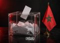 Ballot box and Moroccan flag illustrating the country’s electoral process. (Designed by MWN team)