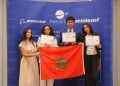 Moroccan students display their AeroSTAR achievement certificates alongside Morocco’s flag at a ceremony organized by Boeing and Amideast.