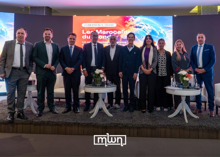 A group photo featuring Lahcen Aqartit, Steven Höfner, Samir Bennis, Jamal Belahrach, Karim Amor, Nisrine Aouzdagh, Hafida Moukadiri, Bouchra By, and Mohamed El Karz, pictured from left to right, by MWN Photographie Team.