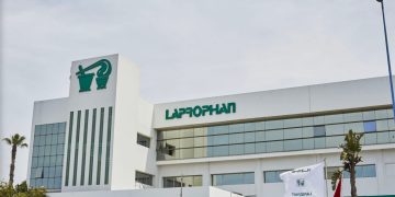 Exterior view of Moroccan pharmaceutical company Laprophan’s headquarters, featuring its green logo and signage on the building’s facade.