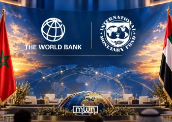 An illustrative image featuring the World Bank and IMF logos, flanked by the Moroccan and UAE flags against a global economic backdrop. (Designed by MWN team)