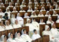 Moroccan parliamentarians attend a speech by King Mohammed VI marking the opening of Parliament’s autumn session in Rabat on October 10, 2003. The King announced a new Family Code granting expanded rights to Moroccan women and reforming marriage laws. Credit: AFP