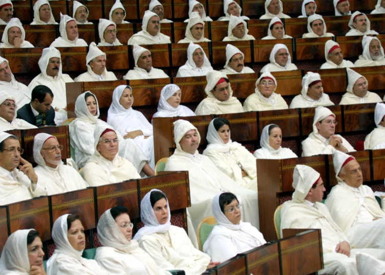 Moroccan parliamentarians attend a speech by King Mohammed VI marking the opening of Parliament’s autumn session in Rabat on October 10, 2003. The King announced a new Family Code granting expanded rights to Moroccan women and reforming marriage laws. Credit: AFP
