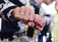 A photo of a Moroccan bride and groom touching fists during their wedding celebration.